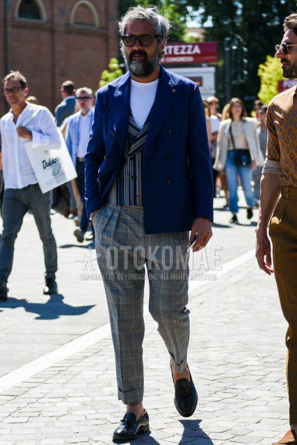 Men's spring, summer, and fall coordinate and outfit with plain black Wellington sunglasses, plain navy tailored jacket, gray striped gilet, plain white t-shirt, gray checked slacks, and black tassel loafer leather shoes.