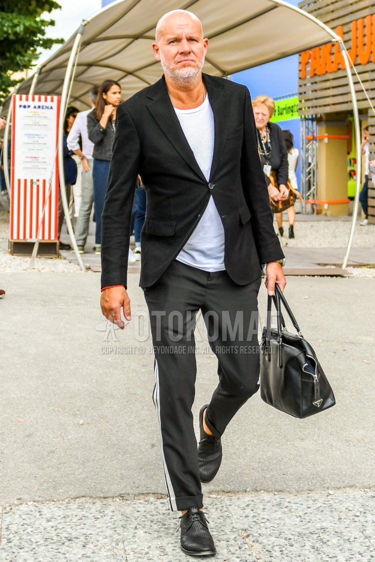 Men's spring, summer, and fall coordination and outfit with plain black tailored jacket, plain white T-shirt, plain black sidelined pants, and black plain toe leather shoes.