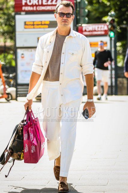 Men's spring/summer coordinate and outfit with brown tortoiseshell sunglasses, plain white shirt jacket, plain white shirt, plain gray t-shirt, plain white slacks, brown tassel loafer leather shoes, olive green camouflage tote bag.