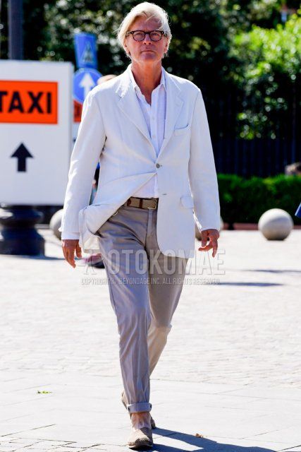 Men's spring/summer coordinate and outfit with plain black glasses, plain white tailored jacket, plain white shirt, plain beige tape belt, plain purple/gray slacks, and plain beige espadrilles.