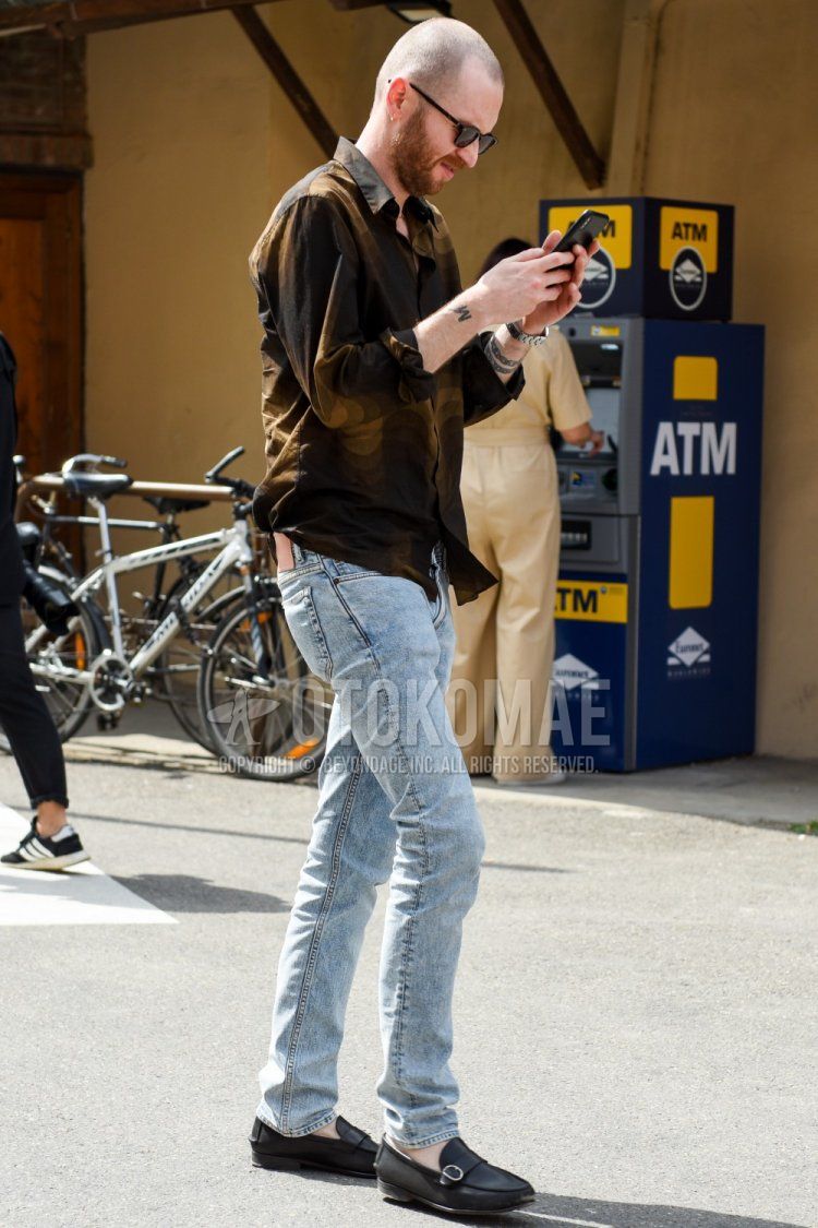 Men's spring, summer, and fall coordinate and outfit with plain black sunglasses, plain brown shirt, plain light blue denim/jeans, and black loafer leather shoes.