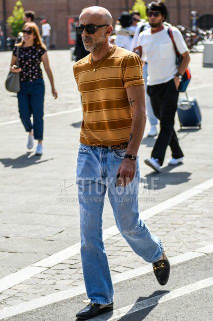 Summer men's coordinate and outfit with Persol plain black sunglasses, brown striped t-shirt, brown leopard leather belt, plain light blue denim/jeans, and black bit loafer leather shoes.