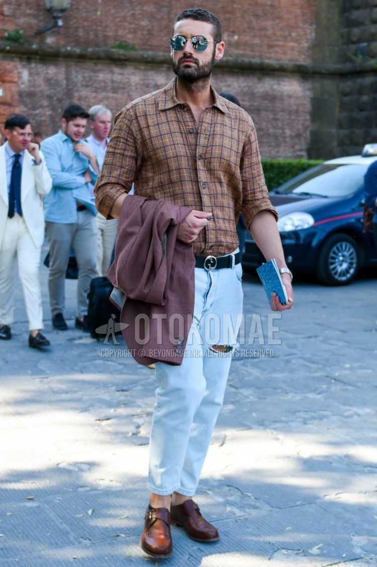 Men's spring/summer/autumn coordinate and outfit with gold plain sunglasses, brown checked shirt, Gucci black plain leather belt, light blue plain damaged jeans, and brown monk shoes leather shoes.