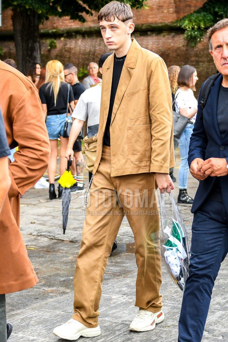 Men's spring/summer/autumn coordination and outfit with black one-pointed T-shirt by Acne Studios, white low-cut sneakers by Gucci, PVC clear solid color briefcase/handbag, and beige solid color suit.