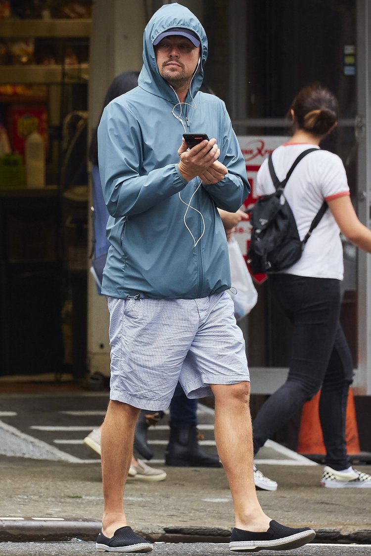 EXCLUSIVE: Actor Leonardo DiCaprio is seen bundled up in a blue windbreaker while meandering through the Greenwich Village neighborhood in NYC