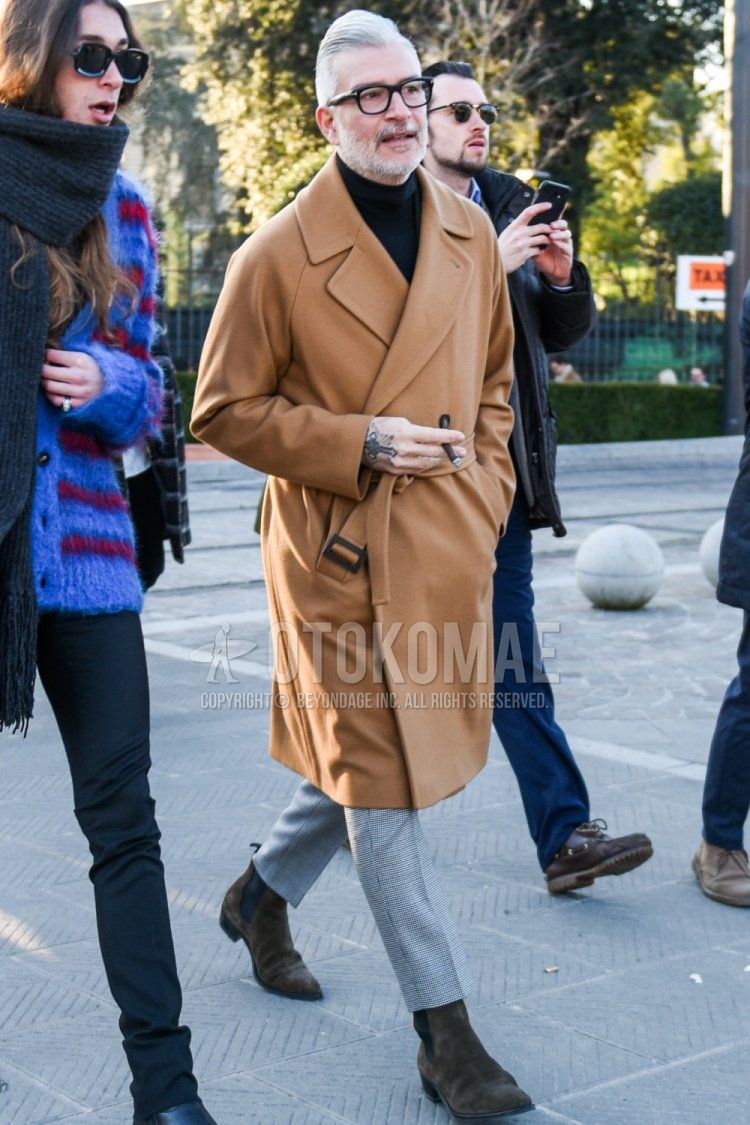 Men's fall/winter outfit with Tom Ford plain black glasses, plain beige belted coat, plain black turtleneck knit, gray checked slacks, gray checked cropped pants, and suede brown side gore boots.