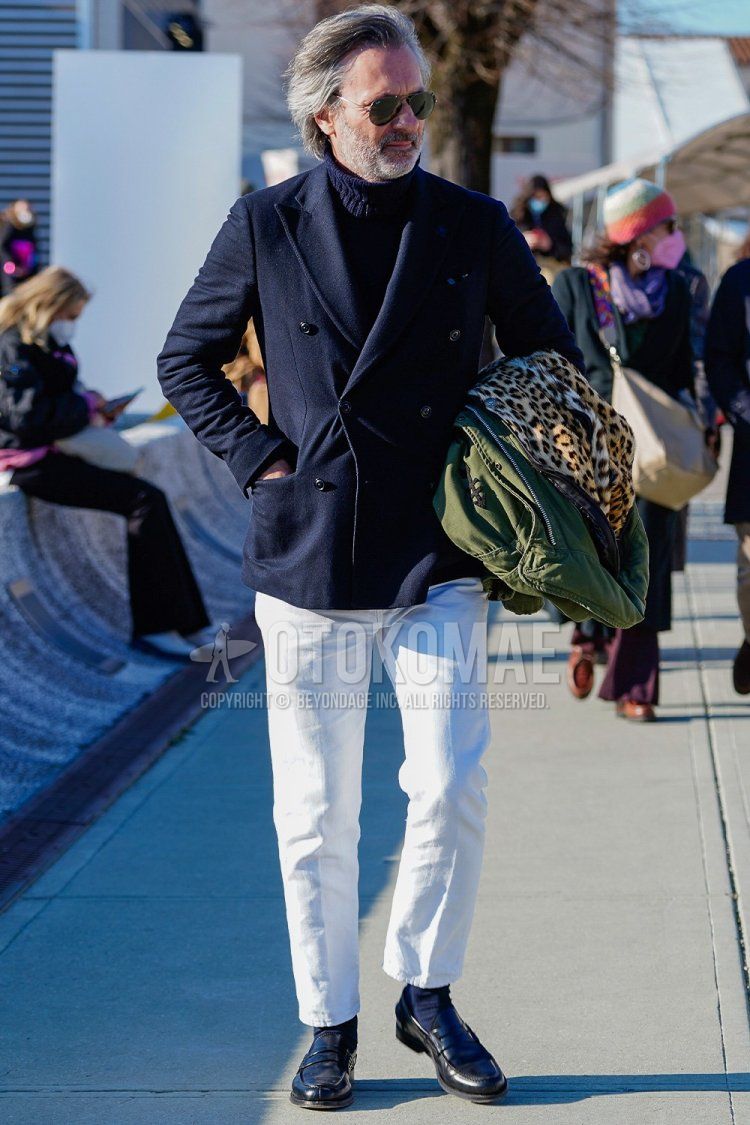 Men's spring/winter outfit with plain silver sunglasses, plain navy tailored jacket, plain navy turtleneck knit, plain white cotton pants, plain white slacks, plain navy socks, and black coin loafer leather shoes.