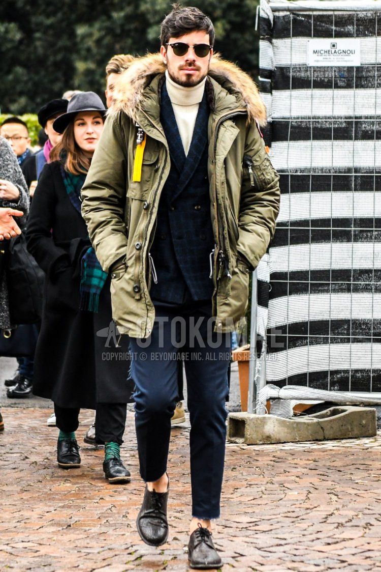Winter men's coordinate and outfit with plain sunglasses, olive green plain down jacket, navy check tailored jacket, plain white turtleneck knit, plain gray slacks, and brown plain toe leather shoes.