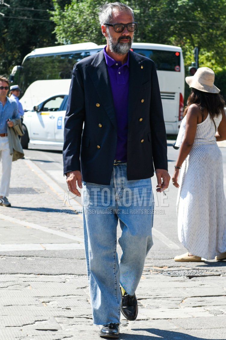 Men's spring/summer/autumn coordinate and outfit with brown/black solid sunglasses, navy solid tailored jacket, purple solid polo shirt, multi-colored solid tape belt, light blue solid denim/jeans, yellow solid socks, black tassel loafer leather shoes.