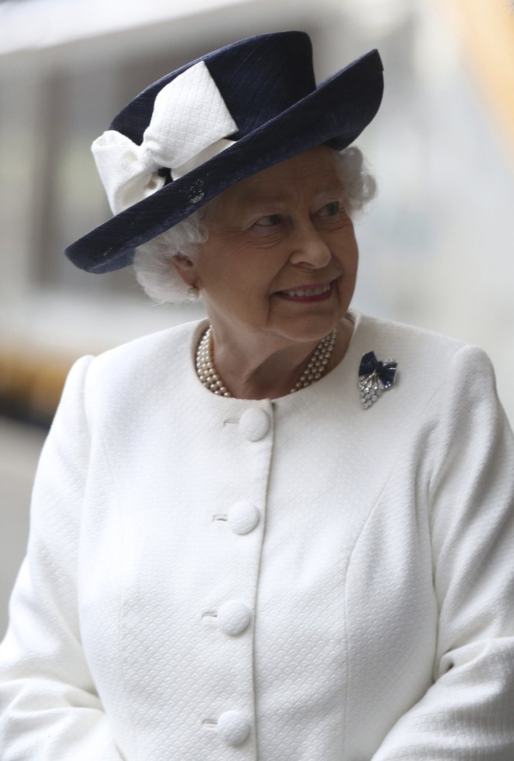 Britain's Queen Elizabeth attends a ceremony to unveil a plaque commemorating the 20th anniversary of the Channel Tunnel at St Pancras Station in London