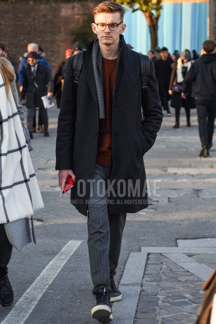 Men's fall/winter coordinate and outfit with brown tortoiseshell glasses, gray scarf/stall, plain gray chester coat, plain brown sweater, gray striped slacks, and black high cut sneakers.