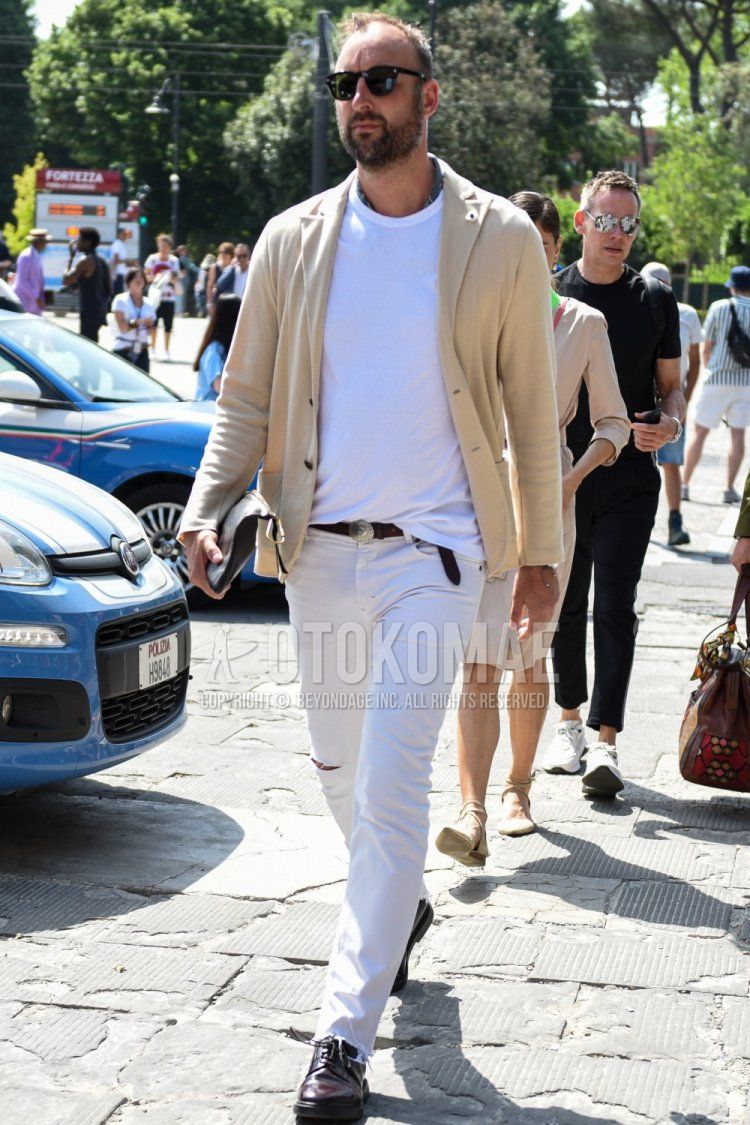 Men's spring, summer, and fall coordinate and outfit with plain black sunglasses from Boston, plain beige tailored jacket, plain white t-shirt, plain brown leather belt, plain white damaged jeans, and brown plain toe leather shoes.