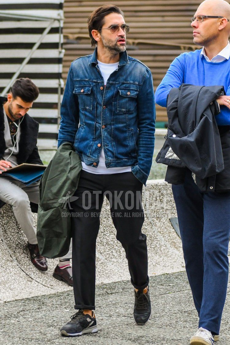 Men's winter coordinate and outfit with solid color sunglasses, solid color blue denim jacket, solid color white t-shirt, solid color black slacks, and black low-cut sneakers.