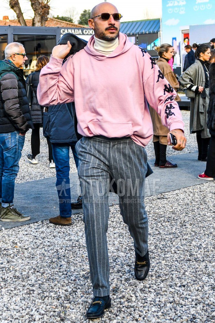 Men's fall/winter outfit with plain sunglasses, plain pink Kappa hoodie, plain white turtleneck knit, gray striped slacks, plain black socks, and black loafer leather shoes.