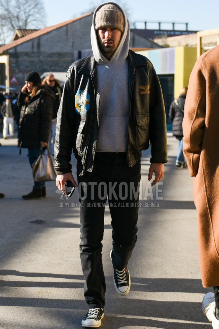 Solid beige knit cap, solid black leather jacket (not riders), solid black military jacket (not MA-1 or M-65), solid gray hoodie, solid black denim/jeans, Play Comme des Garcons Converse Chuck Taylor black high-cut sneakers Men's fall/winter coordinate/outfit with a pair of Play Comme des Garcons Converse Chuck Taylor black high-cut sneakers.