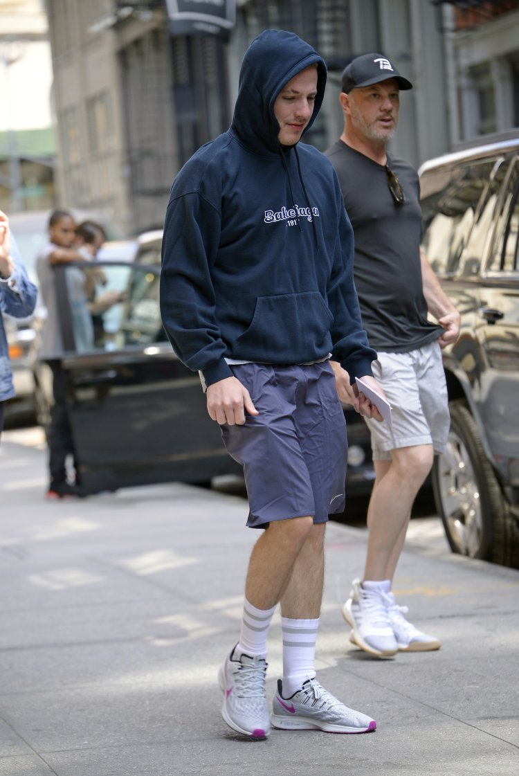 Charlie Puth wears a Balenciaga sweater while out in SOHO in New York City