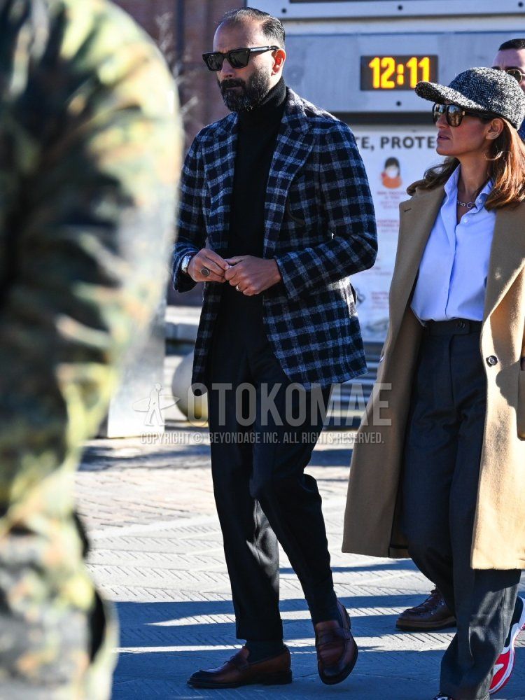 Men's fall/winter/spring coordinate and outfit with plain black sunglasses, gray checked tailored jacket, plain black turtleneck knit, plain black slacks, plain black socks, and brown coin loafer leather shoes.