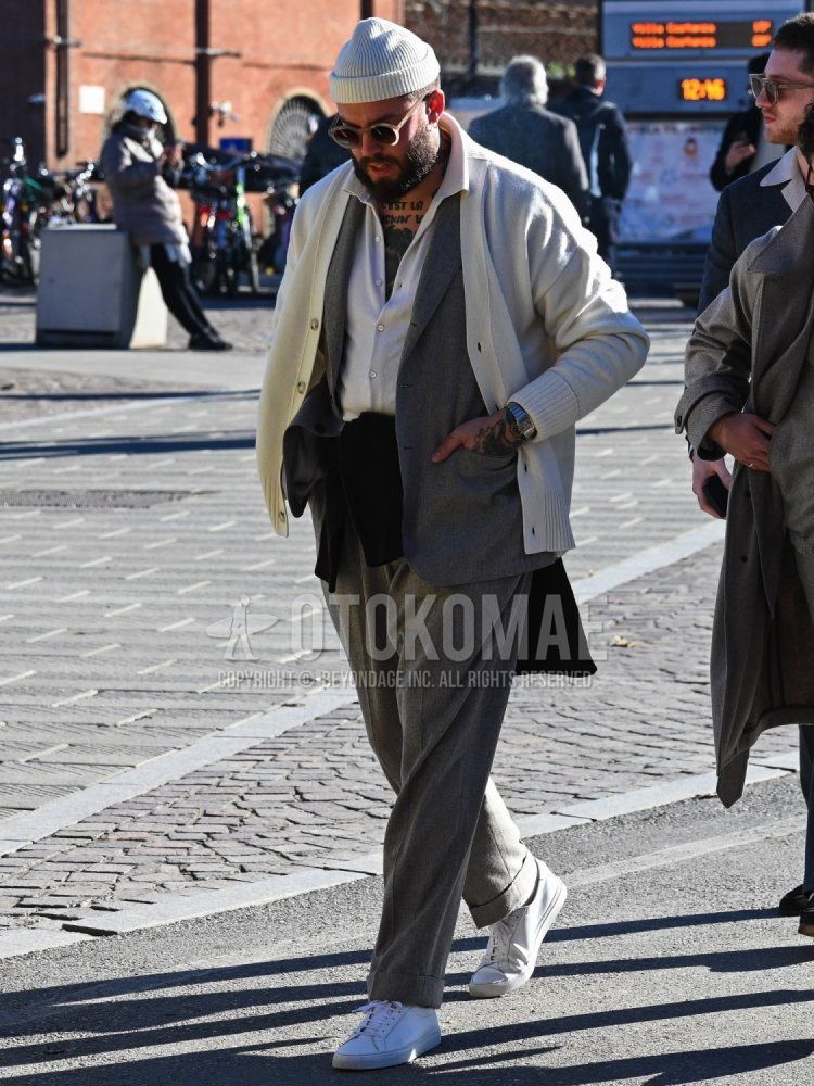 Men's fall/winter coordinate and outfit with plain white knit cap, clear/beige plain sunglasses, plain white cardigan, plain white shirt, white low-cut sneakers, and plain gray suit.