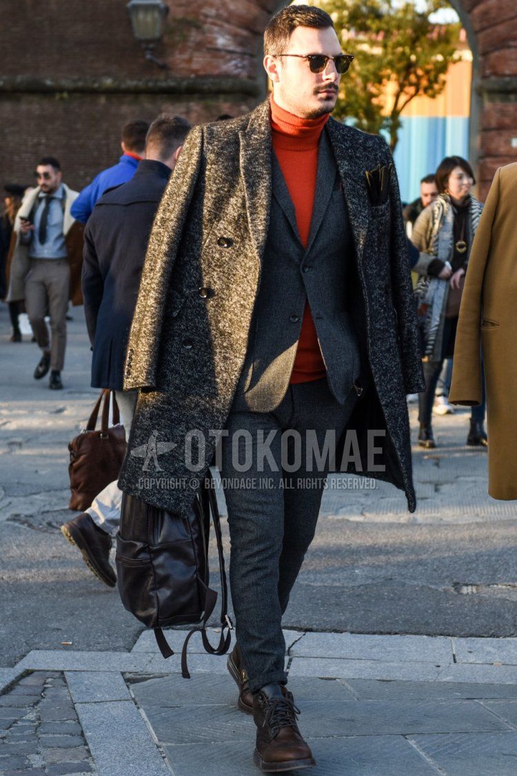 Men's fall/winter coordinate and outfit with Ray-Ban Clubmaster Thermal brown tortoiseshell sunglasses, gray outer chester coat, plain orange turtleneck knit, brown work boots, and gray checked suit.
