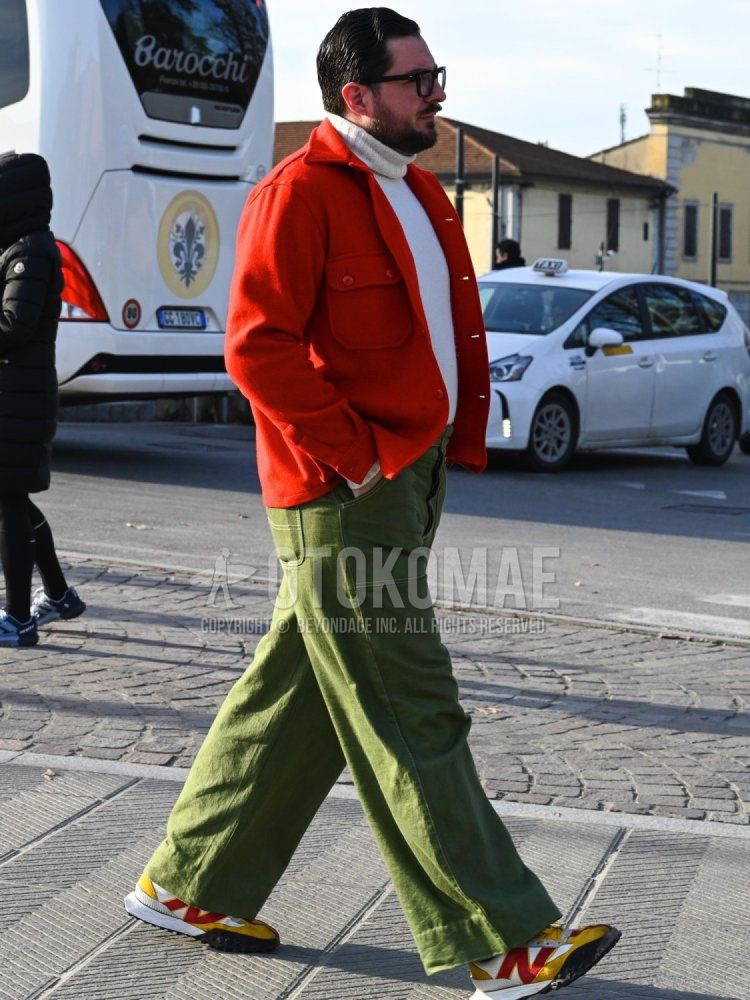 Men's fall/winter coordinate and outfit with plain black glasses, plain red coveralls, plain white turtleneck knit, plain olive green baker pants, and New Balance XC-72 yellow low-cut sneakers.