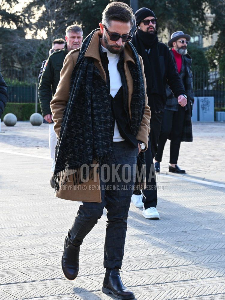 Men's fall/winter outfit with plain black sunglasses, gray checked scarf/stall, plain brown stainless coat, plain white turtleneck knit, plain black gilet, gray checked slacks, and black side gore boots.