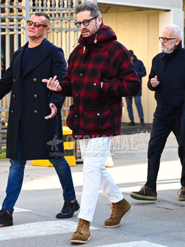 Men's fall/winter coordination and outfit with plain black sunglasses, red checked hooded coat, plain white cotton pants, and brown work boots.