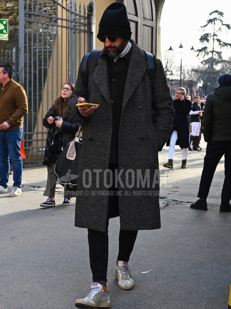 Solid black knit cap, black eyewear sunglasses, gray checked chester coat, dark gray solid coveralls, solid white turtleneck knit, solid black slacks, multi-colored border socks, gray low cut sneakers, solid black backpack. Men's fall/winter outfits and outfits.