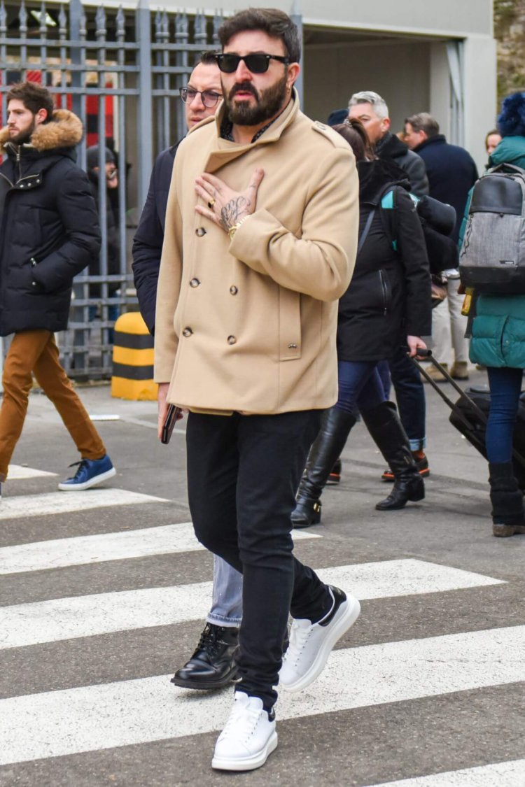 Alexander McQueen sneaker coordinate with beige jacket