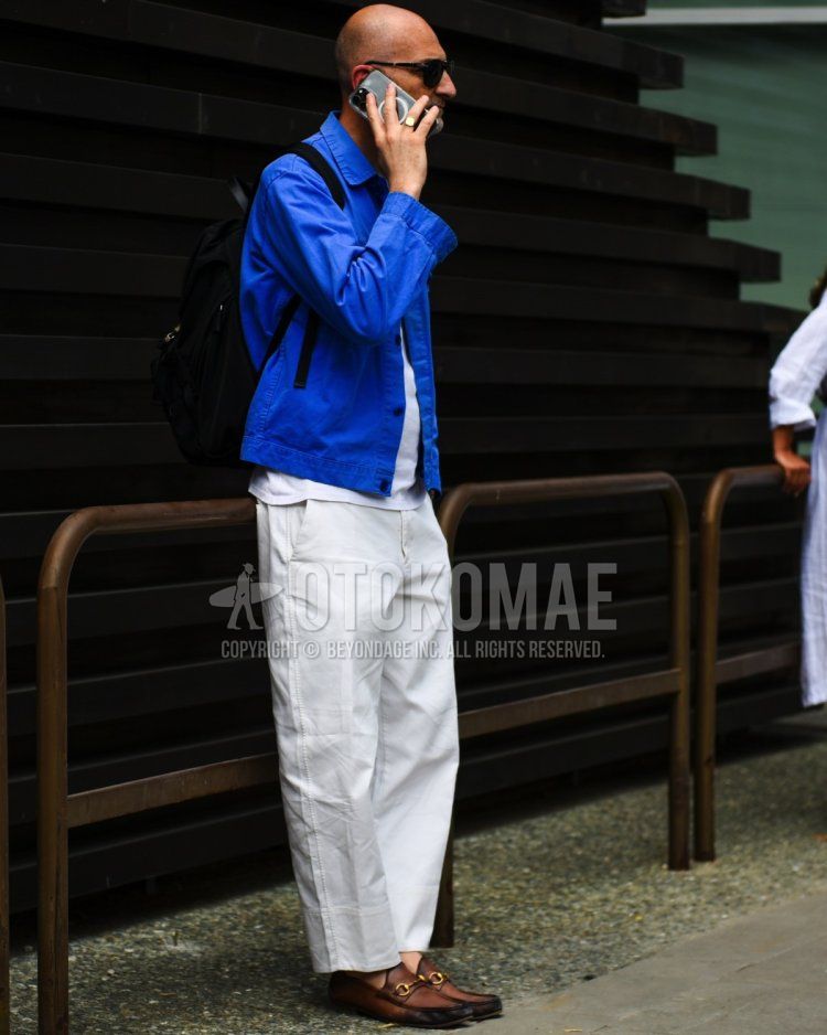 Men's spring/summer coordinate and outfit with plain black sunglasses, plain blue denim/chambray shirt, plain white t-shirt, plain white cotton pants, and brown bit loafer leather shoes.