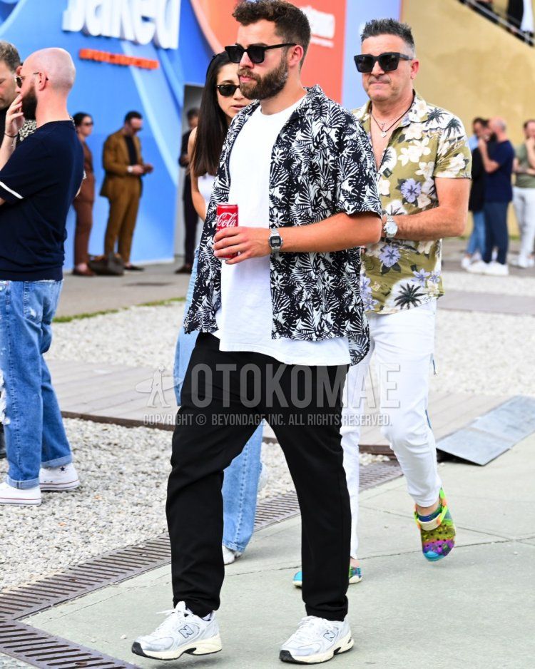 Men's summer coordinate combining Palm Tree patterned shirt, white T-shirt, black pants, and New Balance sneakers