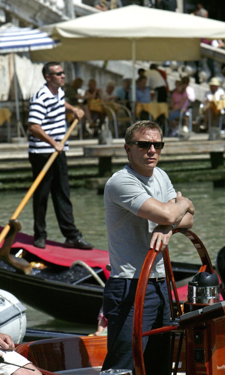 Actor Craig stands at the wheel of a yacht while filming the latest James Bond 007 sequel "Casino Royale" in Venice