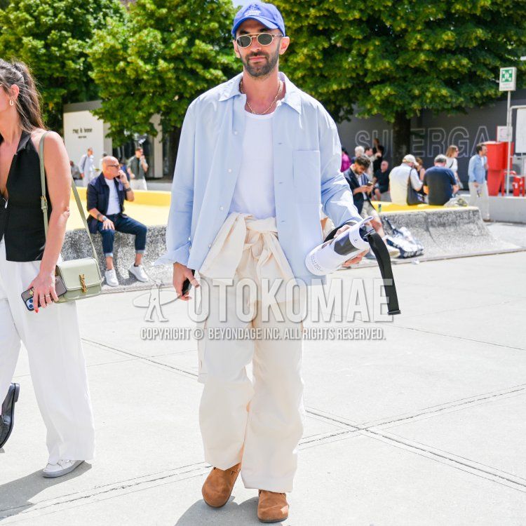 Men's spring/summer coordinate and outfit with blue one-pointed baseball cap, solid gold sunglasses, solid light blue shirt, solid white tank top, solid white cargo pants, and Birkenstock brown leather sandals.
