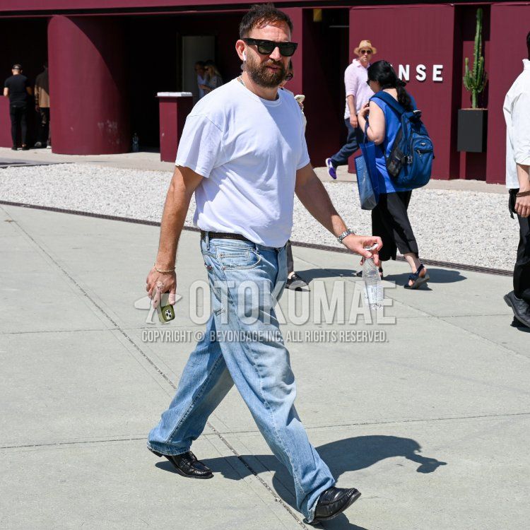 Men's summer/spring coordinate and outfit with plain black Ray-Ban Wellington sunglasses, plain white t-shirt, brown taped belt, plain blue denim/jeans, and black coin loafer leather shoes.