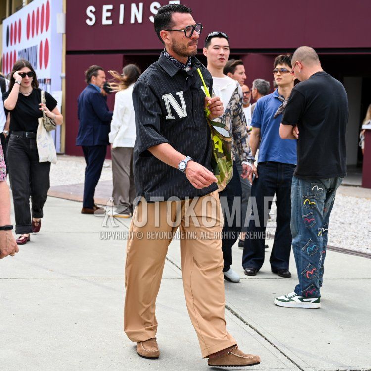 Summer/spring men's coordinate and outfit with plain black glasses, black paisley bandana/neckerchief, black striped shirt, plain beige slacks, plain beige socks, beige leather sandals, beige suede leather shoes, and multicolor lettered tote bag.