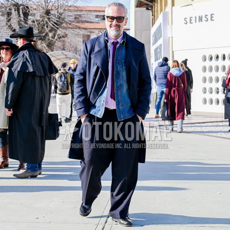 Men's fall/winter outfit with Wellington plain black sunglasses, plain navy Ulster coat, plain blue denim jacket, plain pink shirt, plain navy wide pants, plain navy pleated pants, black leather shoes, and plain red tie.