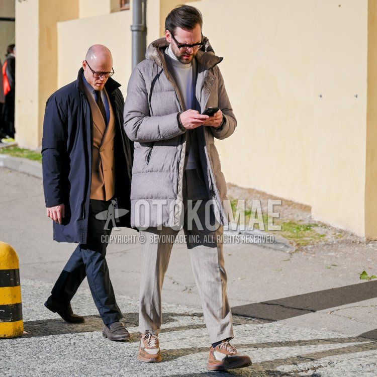 Men's fall/winter coordinate and outfit with plain black glasses, plain gray hooded coat, plain gray down jacket, plain white turtleneck knit, brown low-cut sneakers, and gray striped suit.