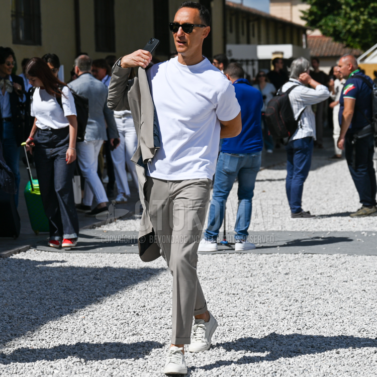 Snapshot of a short-length T-shirt worn with a suit
