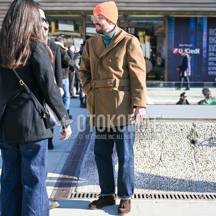 Winter men's coordinate and outfit with solid orange knit cap, solid gold glasses, solid beige P-coat, solid olive green sweater, solid navy denim/jeans, solid gray socks, and brown tassel loafer leather shoes.