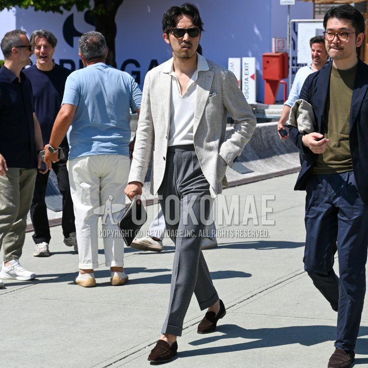 Ray-Ban black tortoiseshell sunglasses, gray checked tailored jacket, plain white polo shirt, plain gray slacks, plain gray ankle pants, brown loafer leather shoes, brown suede shoes leather shoes, plain leather black clutch bag/second bag/drawstring Men's summer/spring coordinate/outfit.