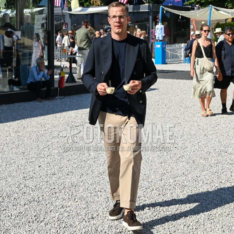 Summer/spring men's coordinate and outfit with plain black glasses, plain black tailored jacket, plain navy t-shirt, plain beige chinos, brown low-cut sneakers, brown suede shoes leather shoes.