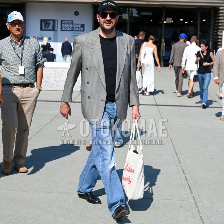 Men's spring/summer outfit with black lettered baseball cap, plain black Tom Ford sunglasses, grey checked tailored jacket, plain black t-shirt, plain blue denim/jeans, black coin loafer leather shoes, white lettered tote bag.