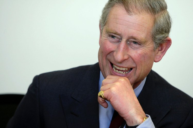 Britain's Prince Charles laughs with students at the Harlem Children's Zone in New York City
