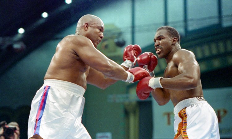 28-year Evander Holyfield takes on 42-year old George Foreman